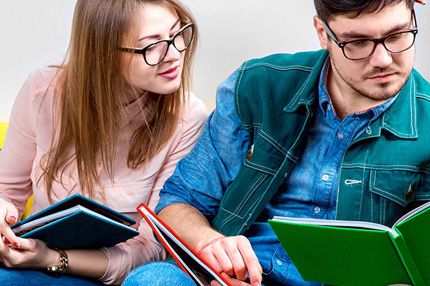 Male female student reading books