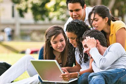 Group of students watching on the laptop
